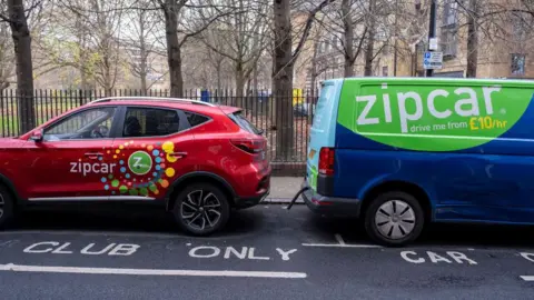 Getty Images A Zipcar car and van parked next to each other in London