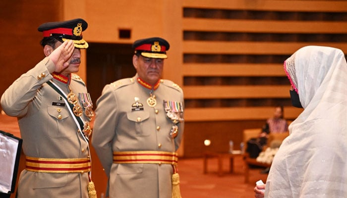 COAS General Asim Munir salutes a relative of a martyred security personnel during a ceremony at Rawalpindis GHQ on April 17, 2025. — ISPR